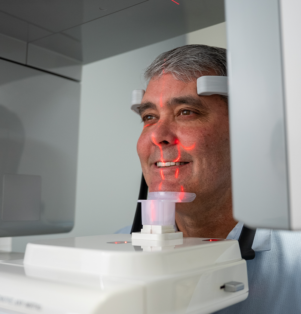 Dr Tooke's patient Jim inside the CBCT scanner